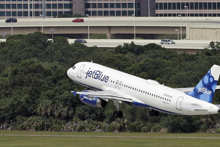 A JetBlue Airways Airbus A320-232 takes off from the Tampa International Airport in Florida on May 15, 2014. Two bodies were found in the landing gear compartment of a JetBlue plane at Fort Lauderdale-Hollywood International Airport on Monday night, the airline said.