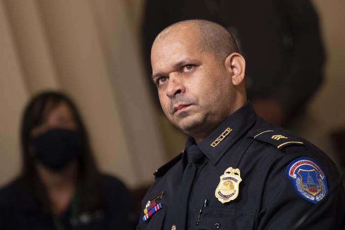 Capitol Police Sgt. Aquilino Gonell watches a video of rioters during a hearing of the House select committee investigating the Jan. 6 attack on the U.S. Capitol on July 27, 2021 in Washington, D.C.