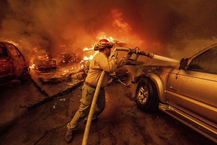 A firefighter battles the Eaton Fire on Wednesday, Jan. 8, in Altadena, Calif.