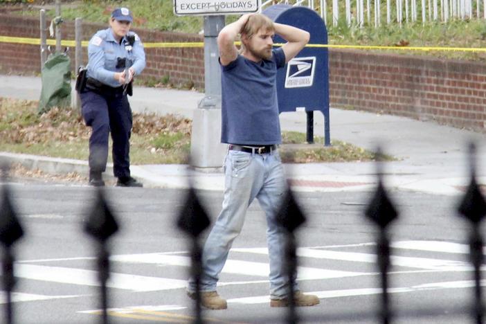 Edgar Maddison Welch, of Salisbury, N.C., is shown surrendering to police, in Washington, D.C., on Dec. 4, 2016.
