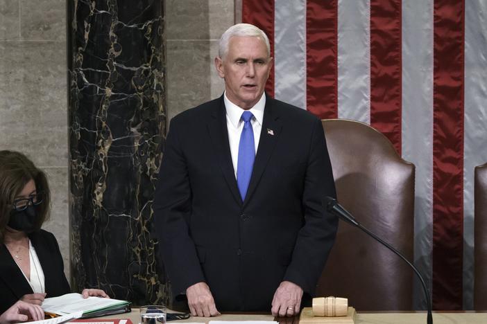 Then-Vice President Mike Pence reads the final certification of Electoral College votes after the Jan. 6 Capitol riot in 2021. A new law clarifies that the vice president's role in the counting of electoral votes is ministerial. Congress will count the votes from the 2024 presidential election on Monday.