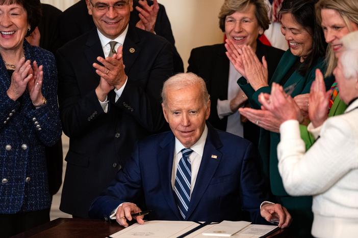 President Biden signs the Social Security Fairness Act during an event in the East Room of the White House on Monday in Washington, DC.
