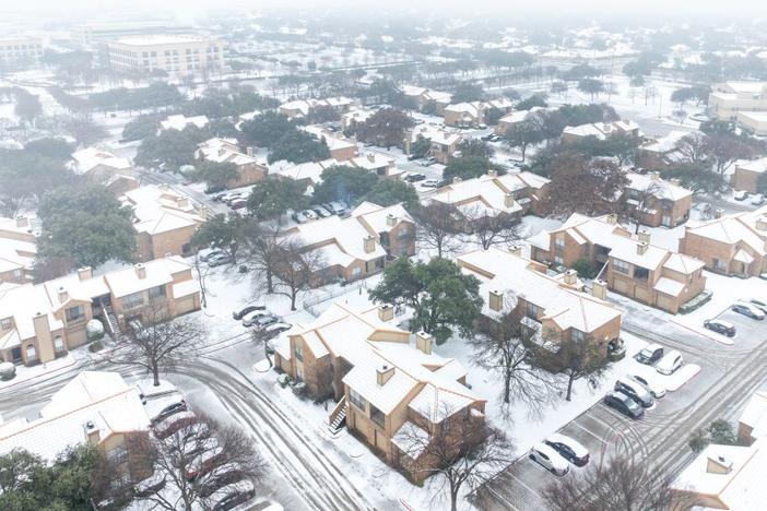Snow fell across northern Texas, including in Plano, Texas, Thursday as a major winter storm began moving across the southern U.S.