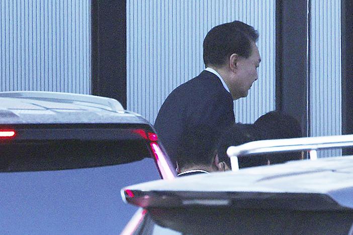 Impeached South Korean President Yoon Suk Yeol arrives at the Corruption Investigation Office for High-ranking Officials in Gwacheon, South Korea on Wednesday.