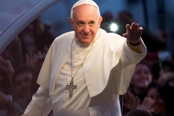 Pope Francis waves from the Popemobile in Rio de Janeiro, Brazil.