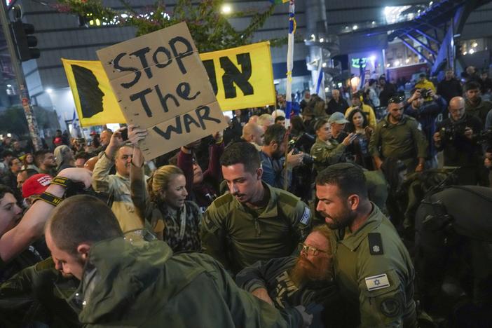 Police scuffle with demonstrators who block a road during a protest demanding a cease-fire deal and the immediate release of hostages held in the Gaza Strip by Hamas, in Tel Aviv, Israel on Saturday.