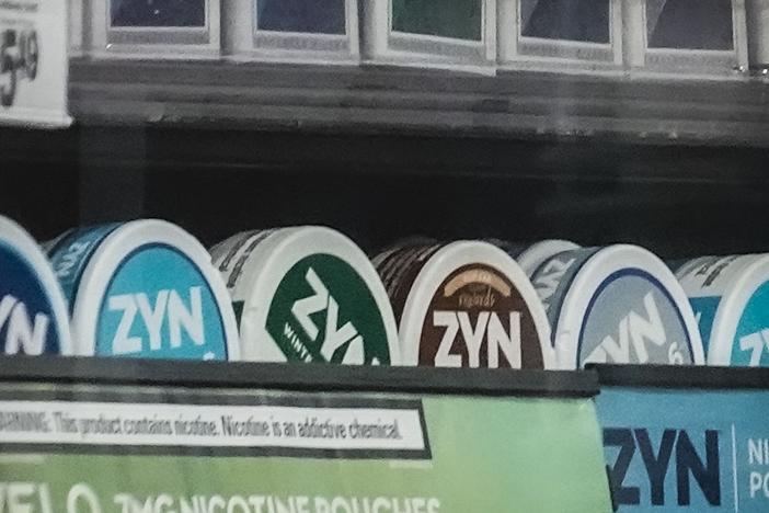 Containers of Zyn, a smokeless nicotine pouch, are displayed for sale among other nicotine and tobacco products at a newsstand in New York on Feb. 23, 2024.