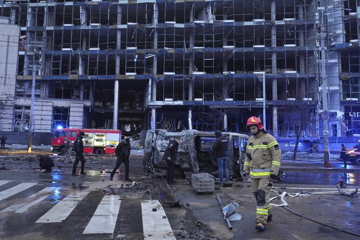 First responders work the scene following a Russian missile attack in Kyiv, Ukraine, on Saturday.