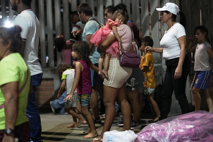 People displaced by violence in towns across the Catatumbo region, where rebels of the National Liberation Army, or ELN, have been clashing with former members of the Revolutionary Armed Forces of Colombia, arrive for shelter at a soccer stadium in Cúcuta, Colombia, on Sunday.