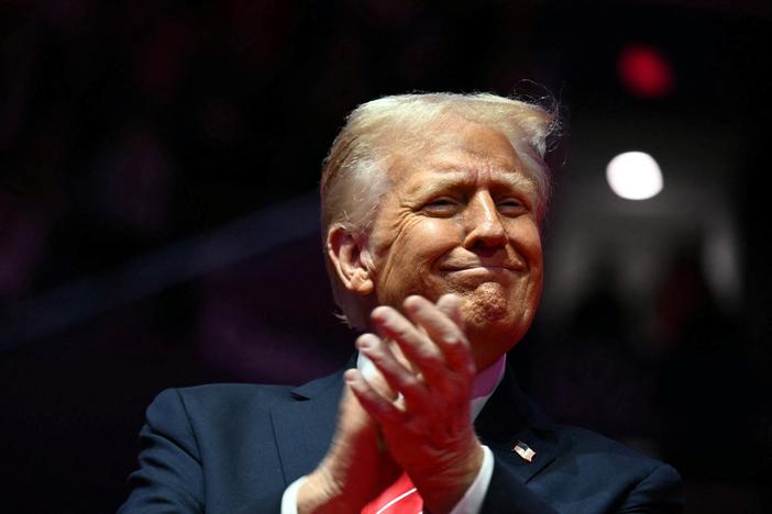 U.S. President-elect Donald Trump reacts during a MAGA victory rally at Capital One Arena in Washington, DC on Sunday, one day ahead of his inauguration ceremony.