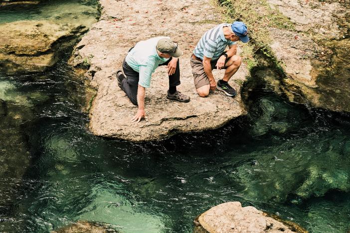 Jay Exum and Mike Cliburn, board members of the Friends of the Wekiva River, examine the fresh water of the spring on Dec. 11, at Rock Springs in Apopka, Fla.