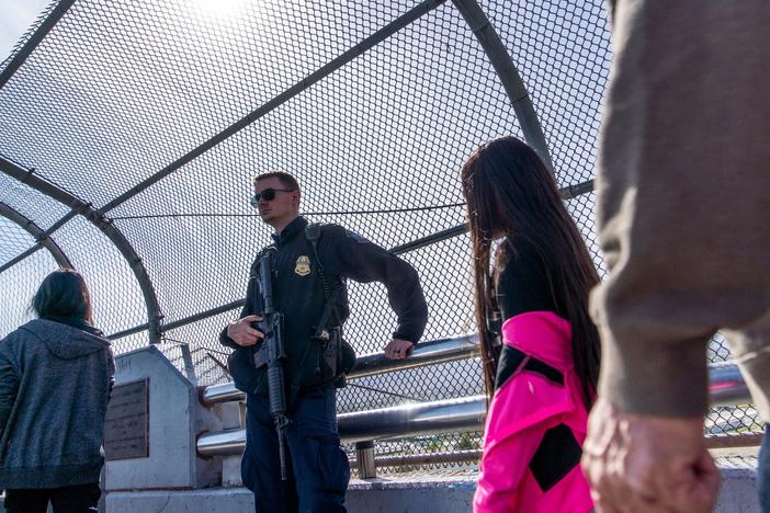 A Customs and Border Protection officer guards the middle of the Paso Del Norte bridge in El Paso, Texas, on Nov. 4, 2018.
