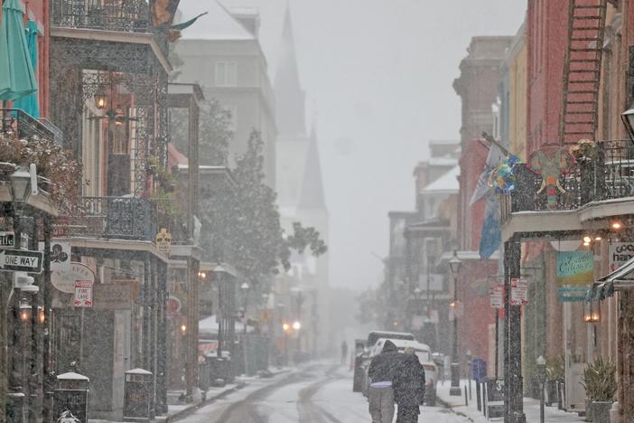 Snow falls on Chartres Street in the French Quarter on Jan. 21, in New Orleans, La.