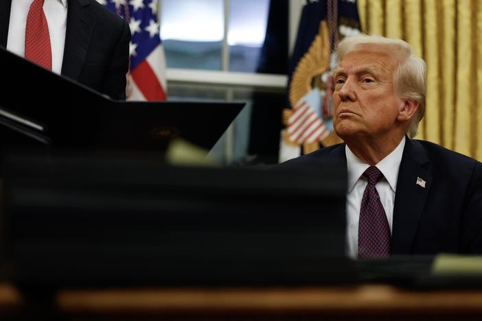 President Trump signs executive orders in the Oval Office on Jan. 20, 2025 in Washington, D.C.