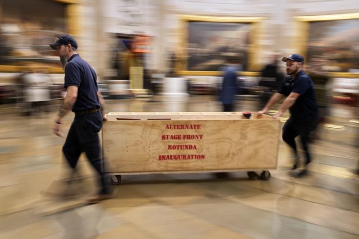 Workers build a stage in the U.S. Capitol Rotunda in Washington on Jan. 17, 2025, for the 60th presidential inauguration, which was moved indoors because of cold temperatures expected on Monday.