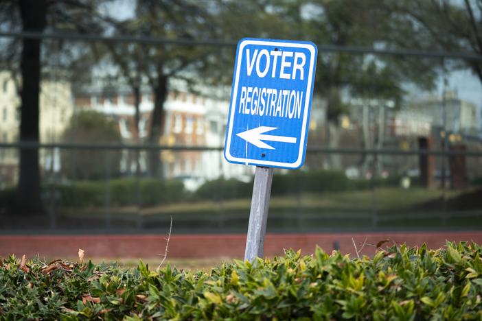 A sign for voter registration stands in Columbia, S.C., in 2024.