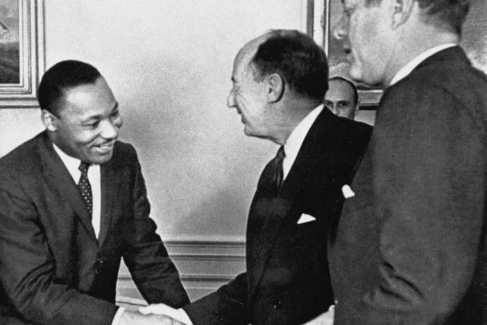 In this Dec. 17, 1962, photo, Ambassador Adlai Stevenson, the U.S. delegate to the United Nations, shakes hands with Martin Luther King Jr., president of the Southern Christian Leadership Conference at the White House with President John F. Kennedy at right. The meeting occurred as Kennedy met with members of the American Negro Leadership Conference on Africa.