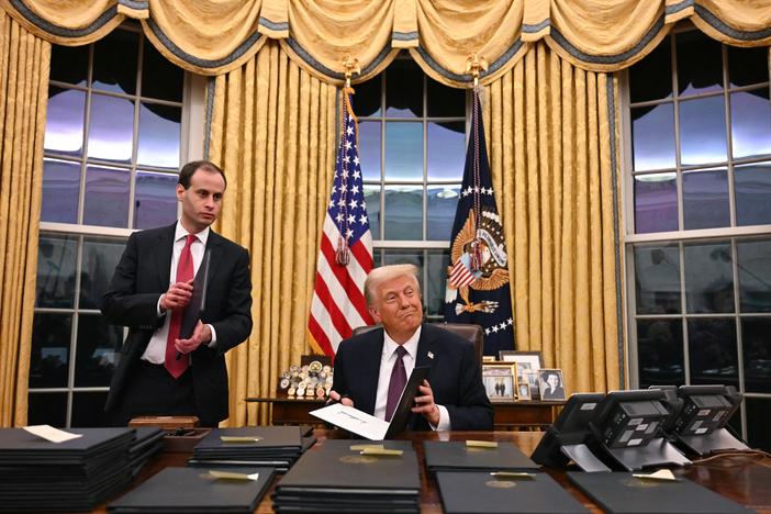 President Trump signs executive actions  at the White House after his inauguration Monday. Among those orders is one labeling Mexican drug cartels terrorist organizations.