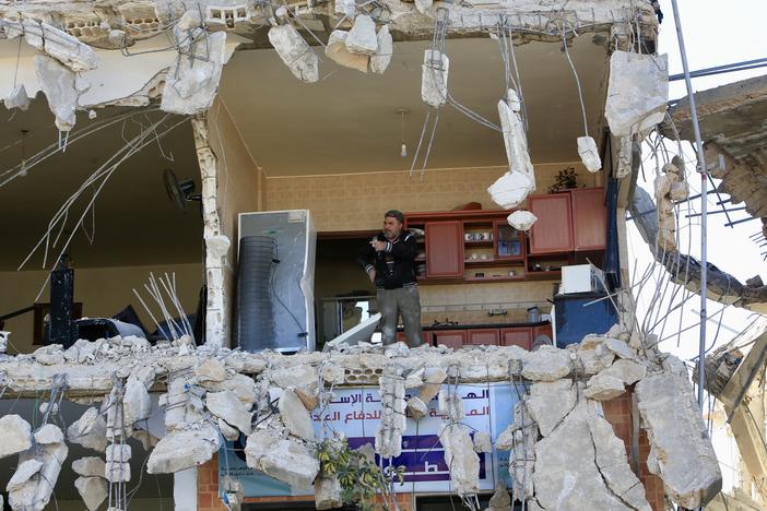 Lebanese citizens return to their homes heavily damaged by Israeli attacks, after Israeli forces withdraw from the area in An-Naqoura, Lebanon, on Thursday.