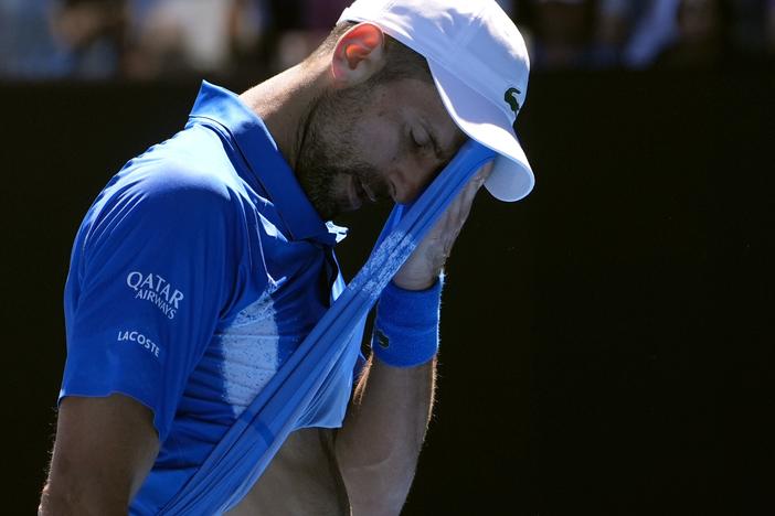 Novak Djokovic of Serbia wipes the sweat from his face during his semifinal match against Alexander Zverev of Germany at the Australian Open tennis championship in Melbourne, Australia, on Friday.