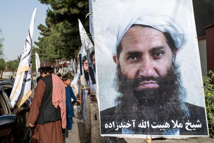 A poster of Taliban Supreme Leader Hibatullah Akhundzada is seen along a road in Kabul. He is one of two leaders named in proposed arrest warrants for their treatment of girls and women since taking power in 2021.