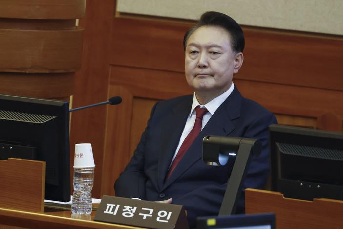 South Korea's impeached President Yoon Suk Yeol attends the fourth hearing of his impeachment trial over his short-lived imposition of martial law at the Constitutional Court in Seoul, South Korea, Thursday, Jan. 23, 2025.