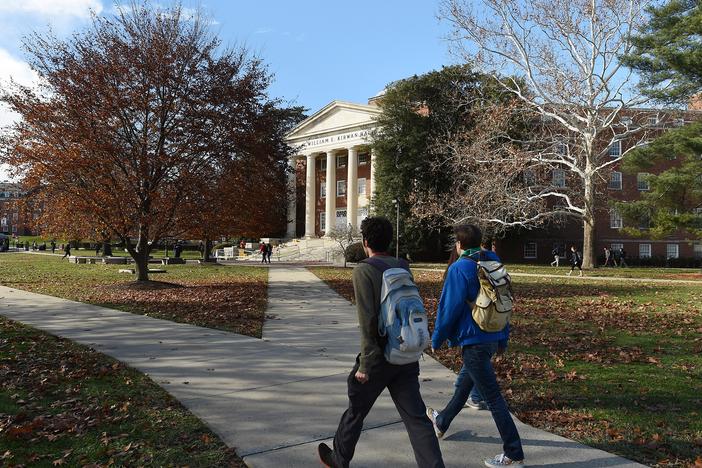 Students walk across the campus of the University of Maryland. A new round of data shows that college enrollment in the U.S. has surpassed pre-pandemic levels.