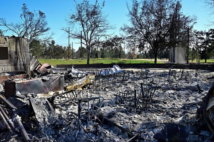 Charred chairs remain amid the ash and rubble from buildings burnt at the Altadena Golf Course during the Eaton Fire, on Jan. 23, 2025 in Altadena, Calif.