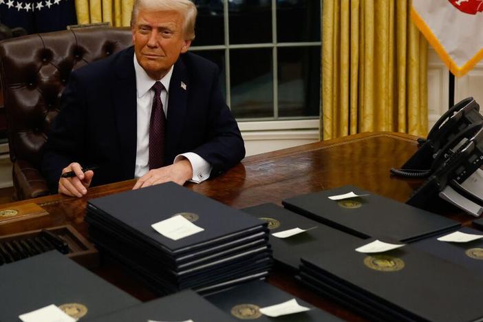 President Donald Trump signs executive orders in the Oval Office on January 20, 2025 in Washington, DC.