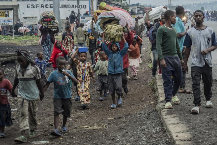 People displaced by the fighting with M23 rebels make their way to the center of Goma, Democratic Republic of the Congo, Sunday, Jan. 26, 2025.