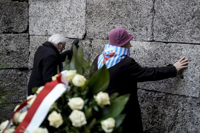 Survivors and relatives attend a ceremony at the Auschwitz-Birkenau former Nazi German concentration and extermination camp, in Oswiecim, Poland, Monday, Jan. 27. 2025.
