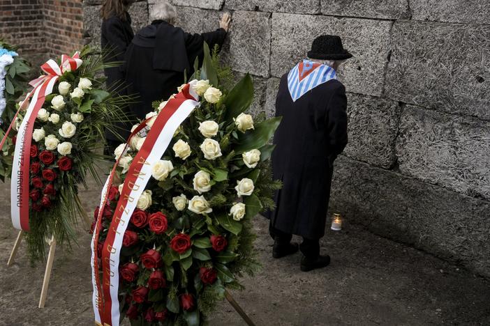 Survivors and relatives attend a ceremony at the Auschwitz-Birkenau former Nazi German concentration and extermination camp, in Oswiecim, Poland, on Monday.