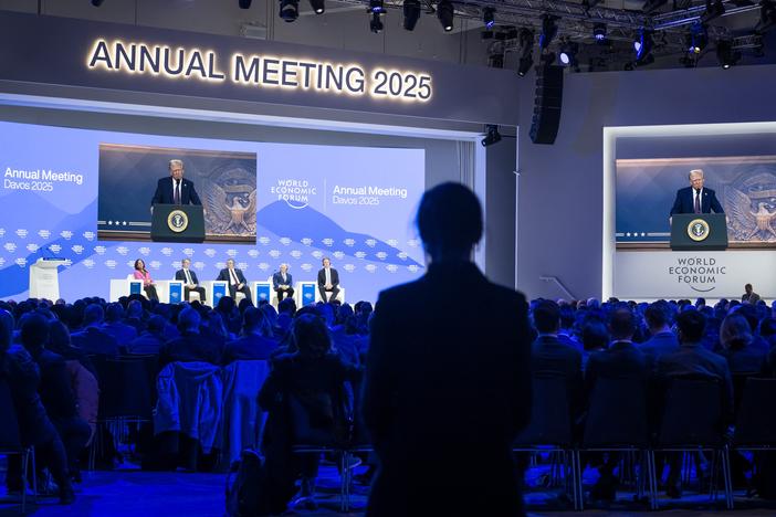 President Trump appears on a large screen during his address by video conference at the World Economic Forum's annual meeting in Davos, Switzerland, on Jan. 23.