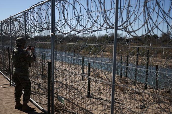 A U.S. Army soldier monitors the border with Mexico in Eagle Pass, Texas, last week. President Trump ordered 1,500 more active military personnel to the southern border, part of a broad immigration crackdown during his first week in office.