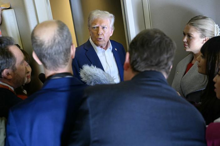 President Trump speaks with the press aboard Air Force One en route to Miami on Saturday.