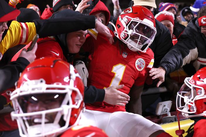 Xavier Worthy #1 of the Kansas City Chiefs jumps into the stands after scoring a touchdown during the second quarter against the Buffalo Bills in the AFC Championship Game at GEHA Field at Arrowhead Stadium on Jan. 26 in Kansas City, Missouri.