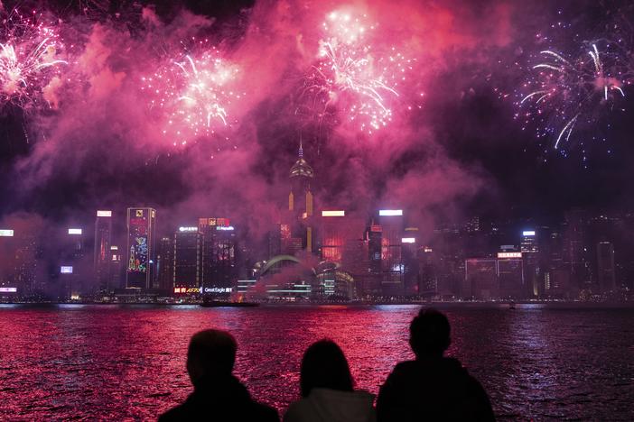 Fireworks light up the sky over Victoria Harbour in Hong Kong on Feb. 11, 2024.