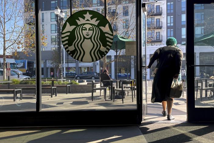 Starbucks is trying to stem the loss of customers by simplifying its menu, reintroducing ceramic mugs and making other changes to be more like a local coffee house.