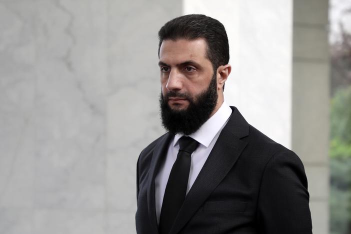 The leader of the new Syrian administration, Ahmed al-Sharaa, waits to meet a Ukrainian delegation on Dec. 30, 2024 in Damascus, Syria.