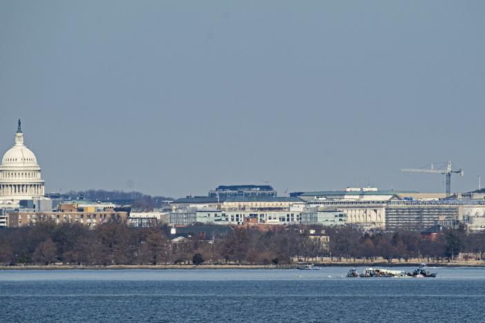 Emergency response units search the crash site of the American Airlines plane on the Potomac River after the plane crashed last night on approach to Reagan National Airport on Thursday in Arlington, Virginia. The American Airlines flight from Wichita, Kansas, collided in midair with a military helicopter while approaching the airport. According to reports, there were no survivors among the 67 people on board both aircraft.