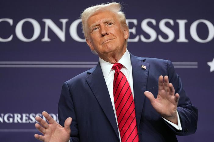 President Trump arrives to speak at the House Republican members conference dinner at Trump National Doral Golf Club in Miami on Jan. 27.