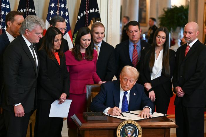 President Trump signs the Laken Riley Act in the East Room of the White House on Jan. 29.
