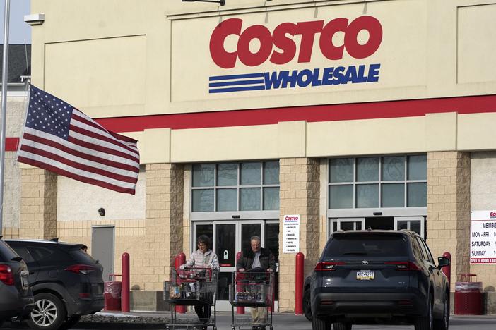 Shoppers exit a Costco warehouse in Cranberry, Pa., on Jan. 28.