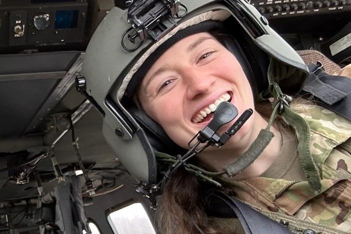 Capt. Rebecca Lobach smiles in the cockpit of a UH-60 Black Hawk helicopter, Feb. 28, 2024. <br>