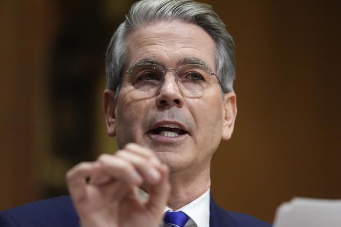 Treasury Secretary Scott Bessent has been tapped by President Trump to be acting director of the Consumer Financial Protection Bureau. Here, he appears before the Senate Finance Committee on Jan. 16.