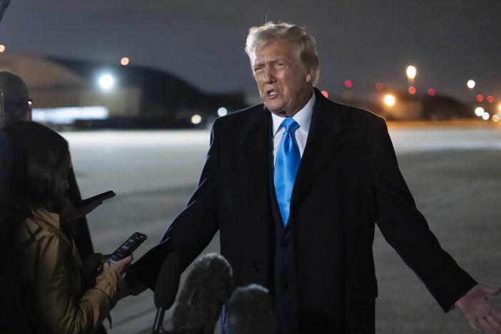 President Trump speaks to reporters next to Air Force One after arriving back at Joint Base Andrews, Md., on Feb. 2.