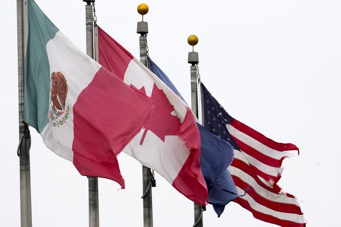 The flags of Mexico, Canada and the United States are shown near the Ambassador Bridge, Monday, Feb. 3, 2025, in Detroit.