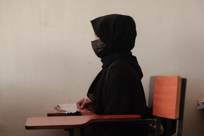 The halt to USAID projects will likely impact secret schools for girls across Afghanistan, which could close as soon as the funds from the U.S. agency go dry. Above: A teenage girl wearing a face mask, head scarf and long black robe at a tutoring center in Kabul, established by a women's rights activist to circumvent a Taliban ban on girls attending secondary school.