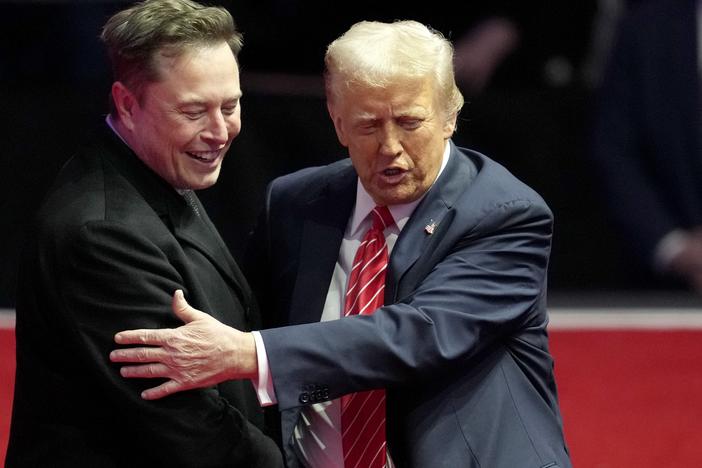 Elon Musk, left, and President-elect Donald Trump embrace at a rally ahead of the 60th Presidential Inauguration on Jan. 19, 2025, in Washington.