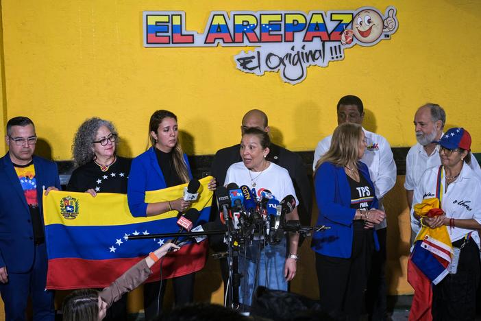Venezuelan community leaders speak to the media in Doral, Fla., on Monday as they protest against the suspension of temporary protected status. The Trump administration is terminating an immigration program that currently protects hundreds of thousands of Venezuelan migrants in the U.S. from deportation.